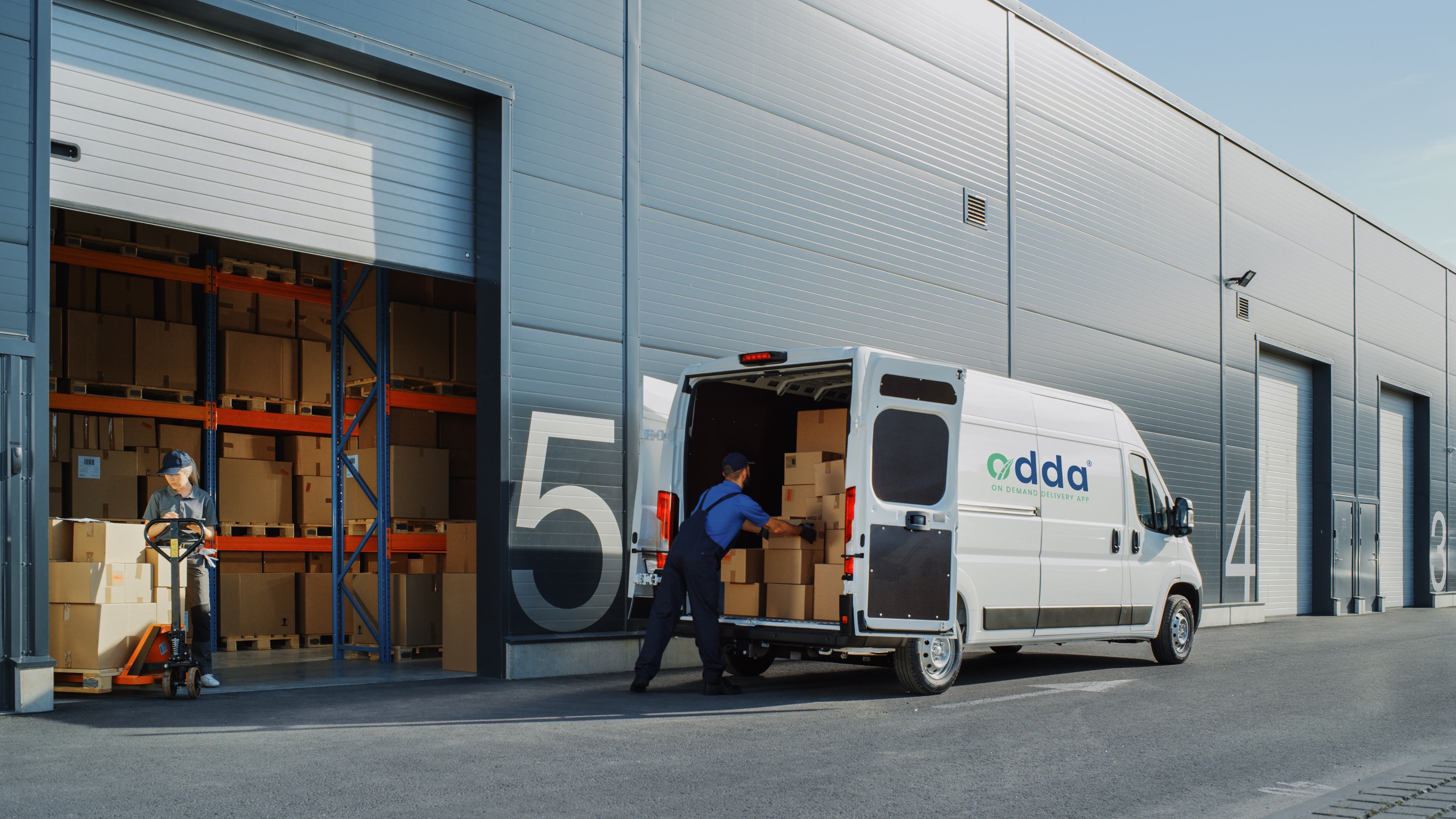 Odda courier collecting an urgent delivery from a business
