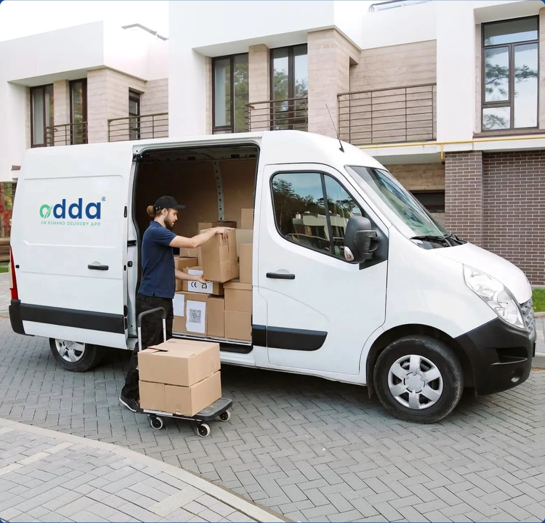 Driver loading delivery van with various parcel packages