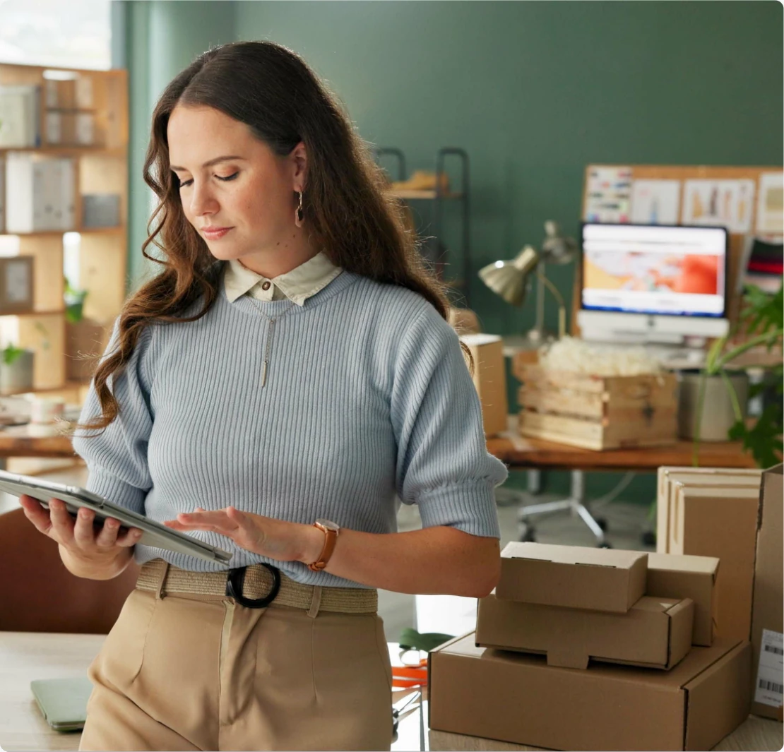 Business manager checking delivery inventory orders on digital tablet