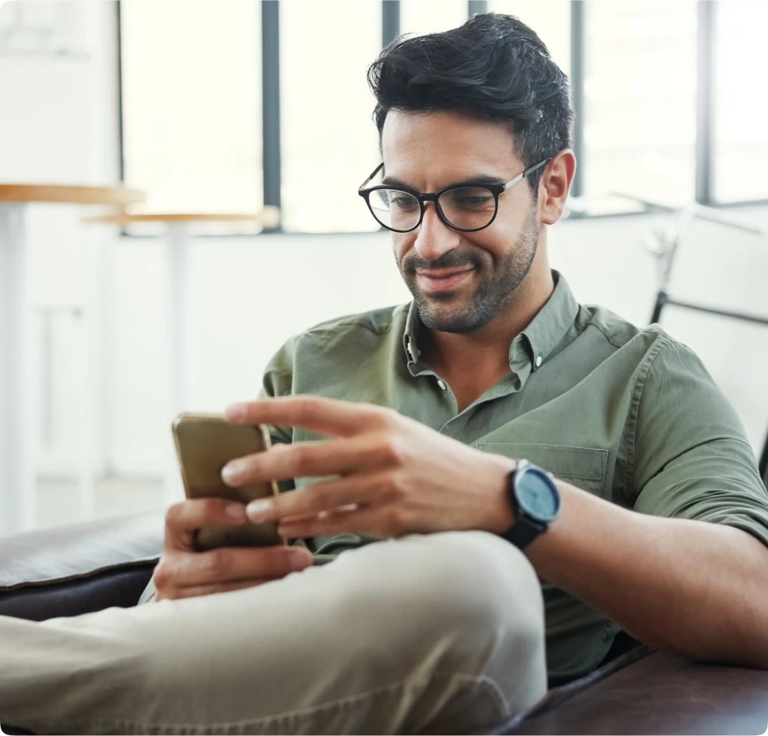 Customer relaxing at home and managing on-demand delivery via mobile app