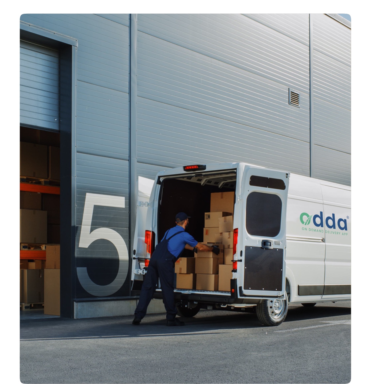 Commercial delivery van parked near a warehouse