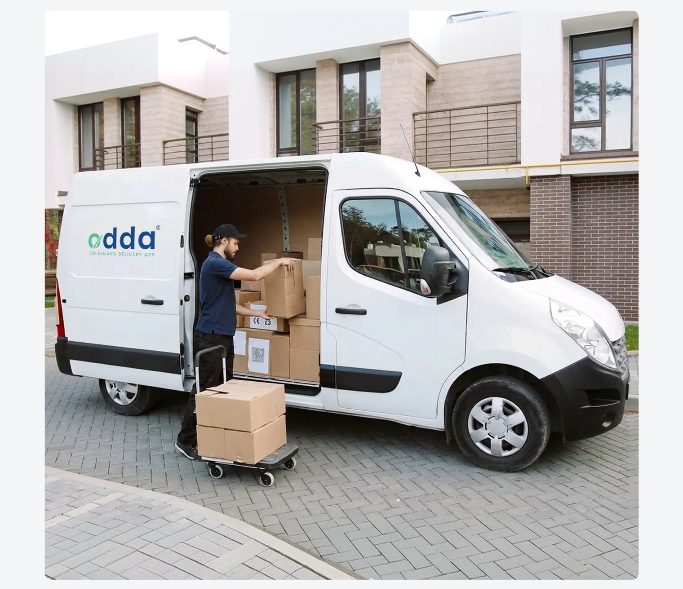 White Odda commercial delivery van driving on the road