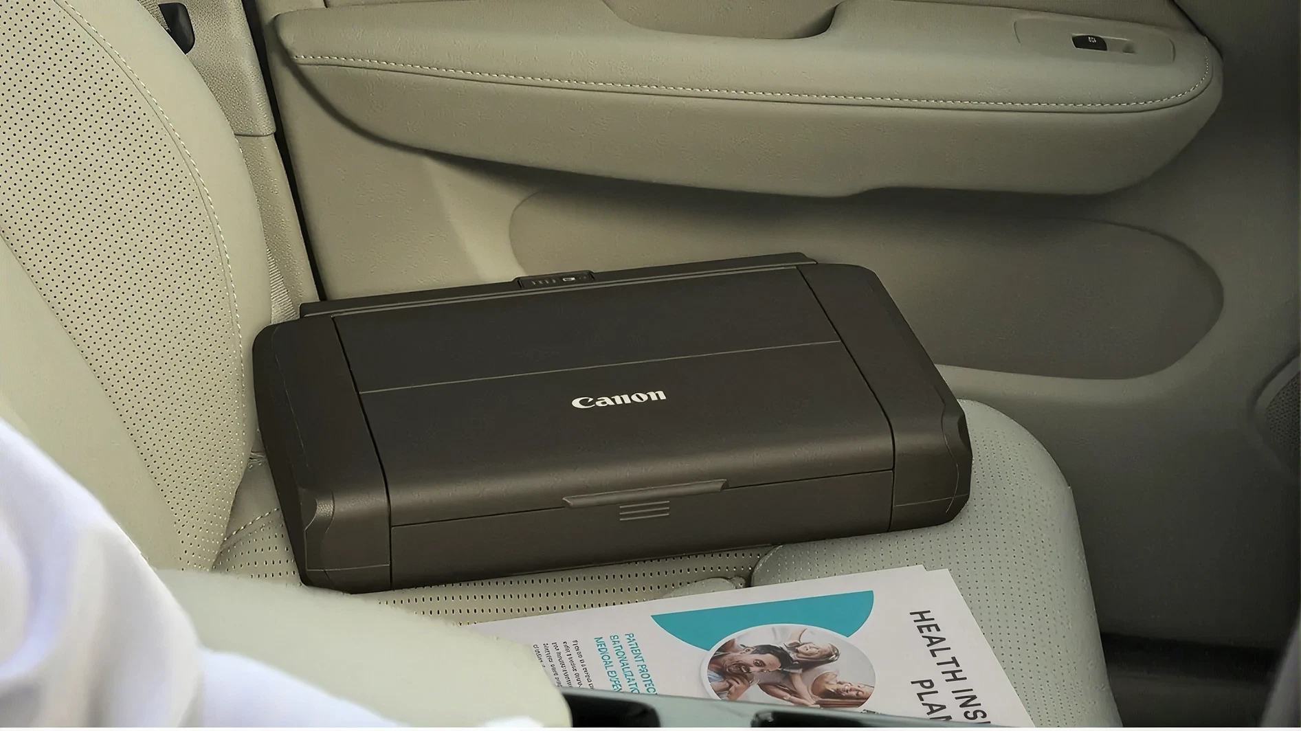 Compact portable printer stored on a car seat