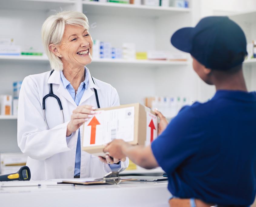 Courier handing medical supplies to a healthcare professional