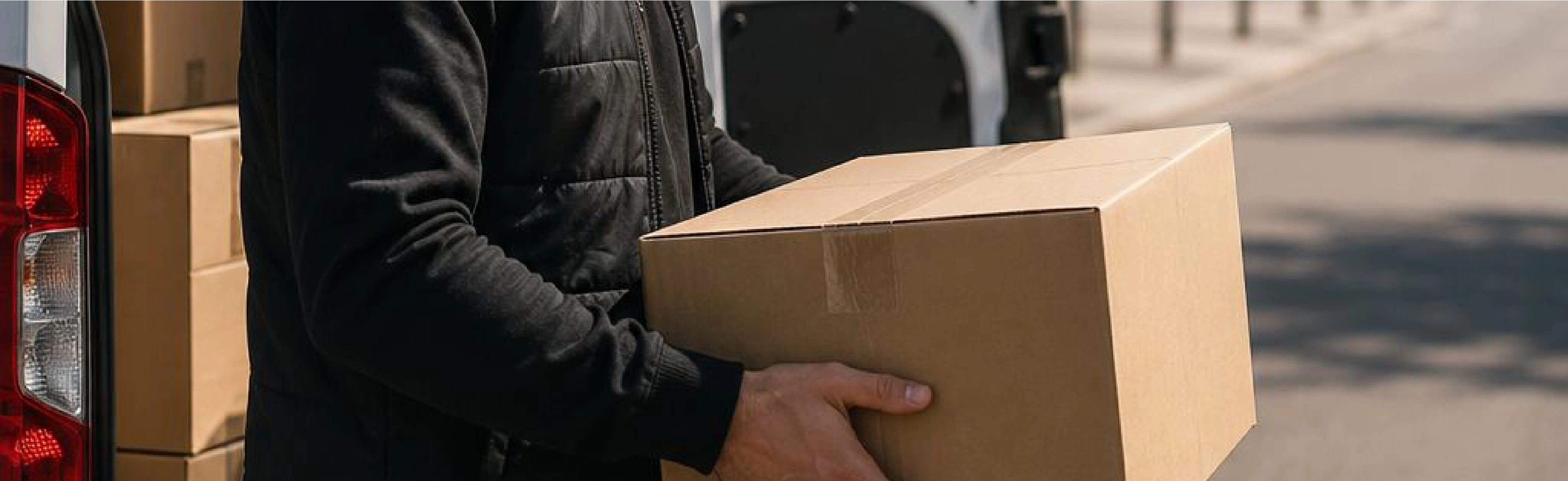 Red delivery vehicle with open rear door showing packages ready for express courier dispatch