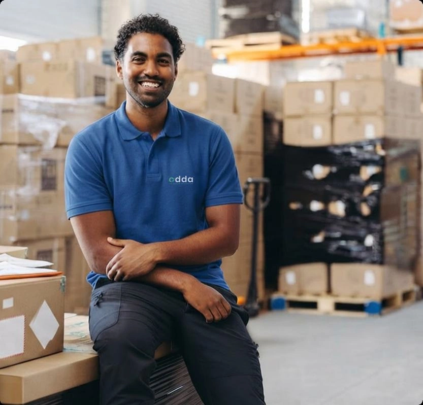 Delivery driver carrying cardboard parcel box