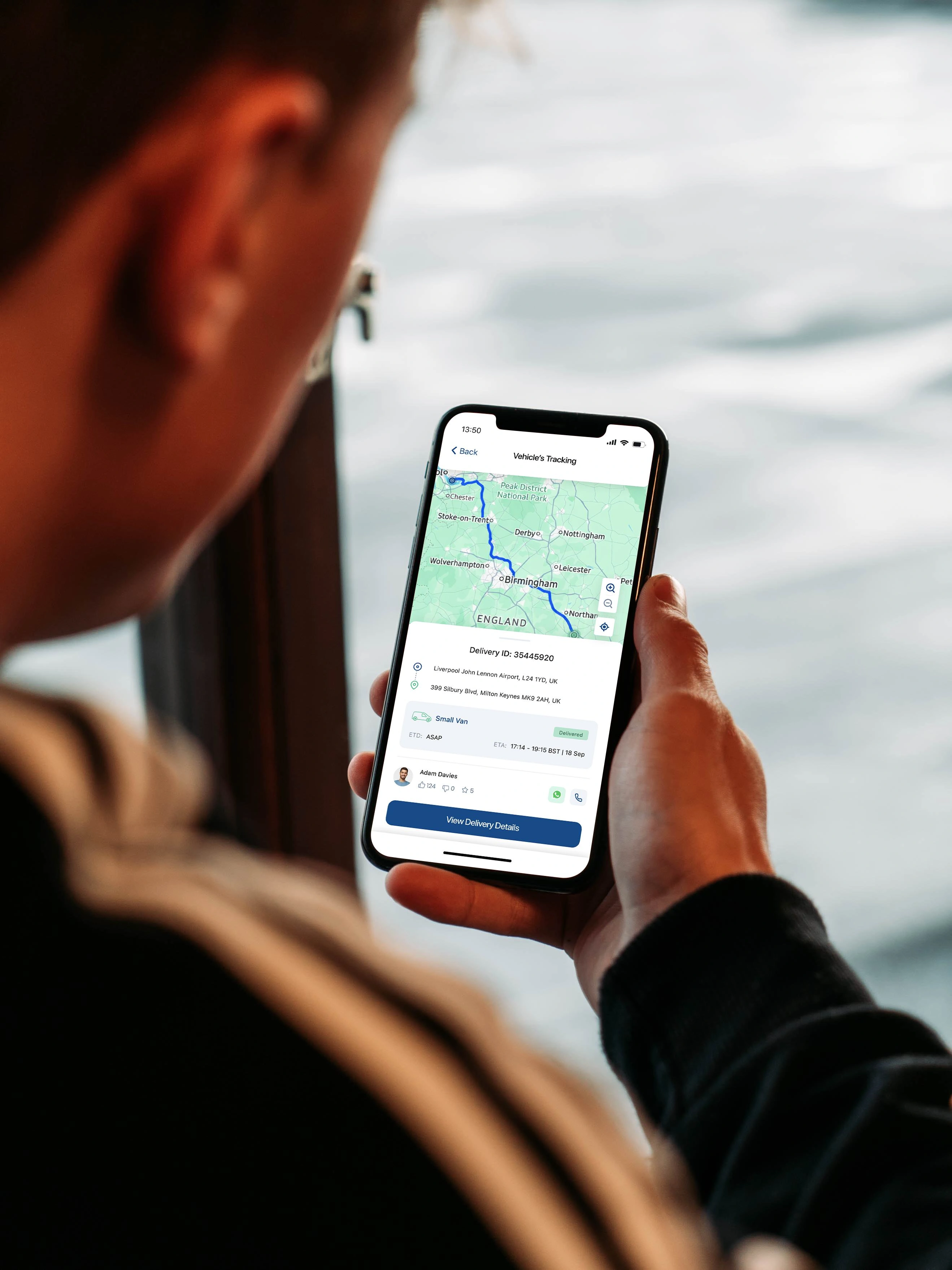 Smartphone displaying live GPS delivery tracking map interface