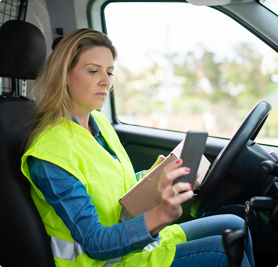 Courier driver using a mobile phone
