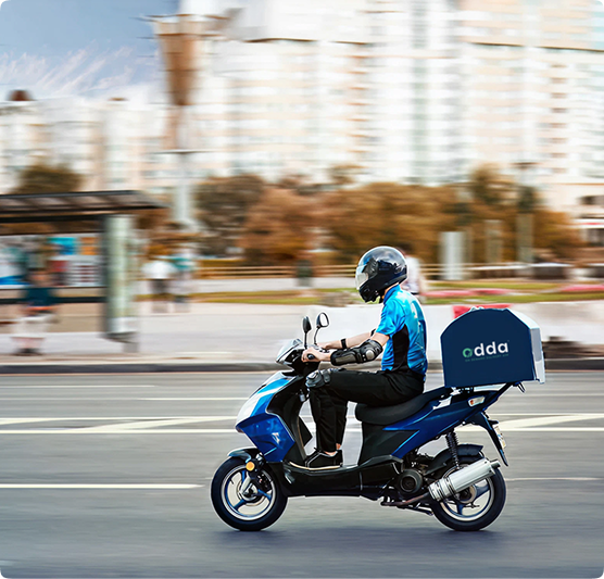 Odda courier riding a delivery scooter